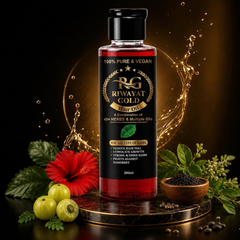 Riwayat Gold hair oil bottle with herbs and flowers on a dark background